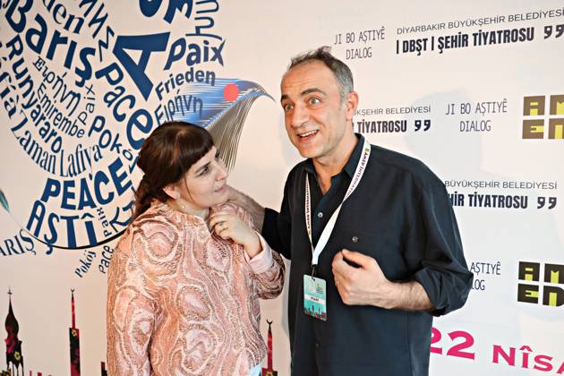 April 29, 2026, Diyarbakir, Turkey: Famous Kurdish theater actress Berfin Emektar and actor Yavuz Akkuzu are seen in front of the festival billboard. The 11th Amed International Theater Festival, organized by the Diyarbakir Metropolitan Municipality and the Amed City Theater from April 22 to May 2, featured theater companies from 19 countries and 22 performances. Diyarbakir Turkey  - ZUMAs197 20260429_aab_s197_029 Copyright: xMehmetxMasumxSuerx