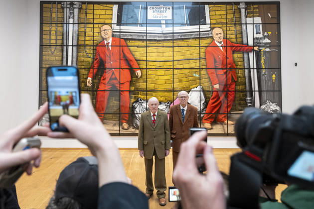 April 30, 2026, London, London, UK: LONDON, UK. Gilbert Prousch and George Passmore, known as Gilbert & George, being photographed with ‘CROMPTON STREETâ€⠢, 2020, from ‘THE NEW NORMAL PICTURESâ€⠢, at a preview of ‘Our George Crompton, WORLDS and WINDOWS by Gilbert & Georgeâ€⠢, a tribute to their friend, George Crompton with works from ‘THE NEW NORMAL PICTURESâ€⠢, exhibited alongside a selection of postcard art from ‘WORLDS and WINDOWSâ€⠢, and ‘THE URETHRA POSTCARD ARTâ€⠢. The show runs 1 May at The Gilbert & George Centre near Brick Lane. London UK - ZUMAl94_ 20260430_zaf_l94_022 Copyright: xStephenxChungx