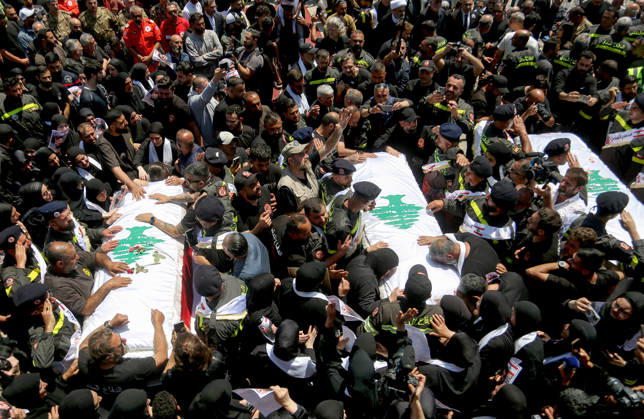 April 30, 2026, Tyre,, Lebanon: Mourners gather around the coffins of three Lebanese Civil Defense members, who were killed in an Israeli air strike in the southern Lebanese village of Majdal Zoun, during their funeral procession in the port city of Tyre. The Israeli military has intensified its campaign in southern Lebanon, issuing new evacuation orders for residents in numerous villages, warning them not to return to the area. Tyre Lebanon  - ZUMAn313 20260430_zip_n313_001 Copyright: xMarwanxNaamanix