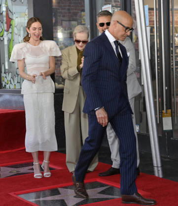 Stanley Tucci walks on his star during a double unveiling ceremony honoring Emily Blunt (L) and Tucci with the 2,841st and 2,842nd star respectively on the Hollywood Walk of Fame in Los Angeles on Thursday, April 30, 2026.  LAP20260430324 JIMxRUYMEN