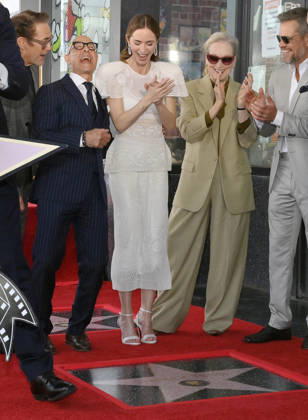 Actors Stanley Tucci (L) and Emily Blunt react during double unveiling ceremony honoring Blunt and Tucci with the 2,841st and 2,842nd star respectively on the Hollywood Walk of Fame as Robert Downey Jr., Meryl Streep and Matt Damon look on in Los Angeles on Thursday, April 30, 2026.  LAP20260430326 JIMxRUYMEN