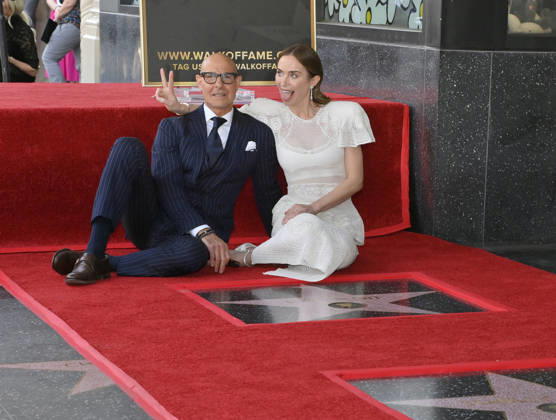 Actors Stanley Tucci (L) and Emily Blunt sits next to her star during a double unveiling ceremony honoring Tucci and Blunt with the 2,841st and 2,842nd star respectively on the Hollywood Walk of Fame in Los Angeles on Thursday, April 30, 2026.  LAP2026043023 JIMxRUYMEN
