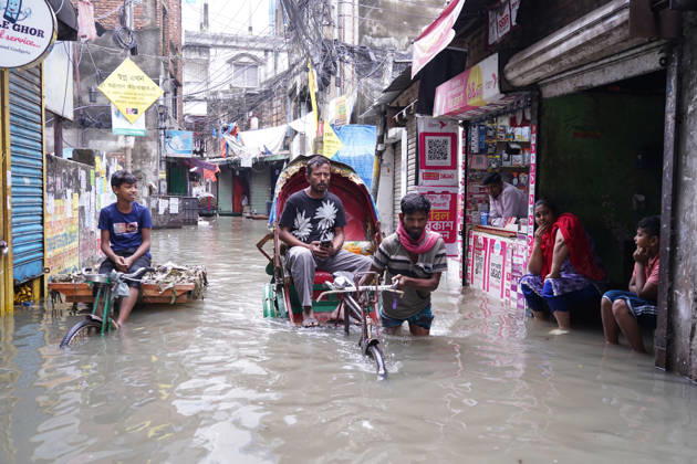 May 1, 2026, Dhaka, Dhaka, Bangladesh: DHAKA, BANGLADESH †May 1, 2026: After several hours of continuous rainfall, many small and major roads across the capital Dhaka were submerged, with water levels ranging from knee-deep to waist-deep in some areas. People forced to leave their homes for work faced severe difficulties, disrupting normal city life. Stray dogs and other animals were also left vulnerable in the flooded conditions. In many cases, clogged manholes filled with plastic waste and debris obstructed drainage systems, leading to widespread waterlogging. Dhaka Bangladesh - ZUMAk185 20260501_zip_k185_006 Copyright: xRubelxKarmakerx