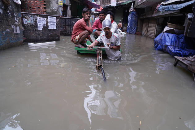 May 1, 2026, Dhaka, Dhaka, Bangladesh: DHAKA, BANGLADESH †May 1, 2026: After several hours of continuous rainfall, many small and major roads across the capital Dhaka were submerged, with water levels ranging from knee-deep to waist-deep in some areas. People forced to leave their homes for work faced severe difficulties, disrupting normal city life. Stray dogs and other animals were also left vulnerable in the flooded conditions. In many cases, clogged manholes filled with plastic waste and debris obstructed drainage systems, leading to widespread waterlogging. Dhaka Bangladesh - ZUMAk185 20260501_zip_k185_007 Copyright: xRubelxKarmakerx