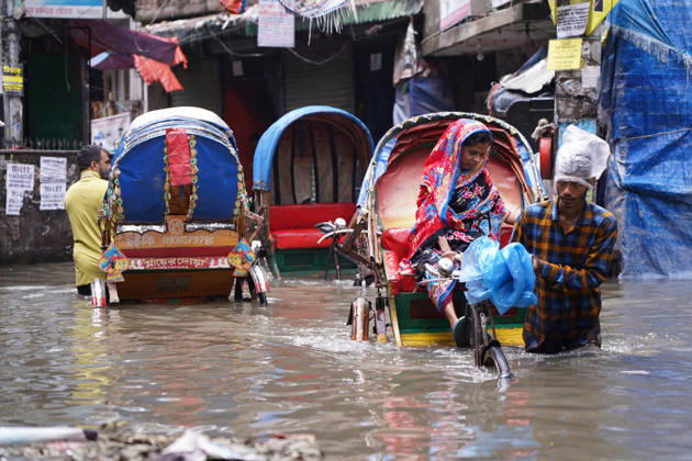 May 1, 2026, Dhaka, Dhaka, Bangladesh: DHAKA, BANGLADESH †May 1, 2026: After several hours of continuous rainfall, many small and major roads across the capital Dhaka were submerged, with water levels ranging from knee-deep to waist-deep in some areas. People forced to leave their homes for work faced severe difficulties, disrupting normal city life. Stray dogs and other animals were also left vulnerable in the flooded conditions. In many cases, clogged manholes filled with plastic waste and debris obstructed drainage systems, leading to widespread waterlogging. Dhaka Bangladesh - ZUMAk185 20260501_zip_k185_003 Copyright: xRubelxKarmakerx