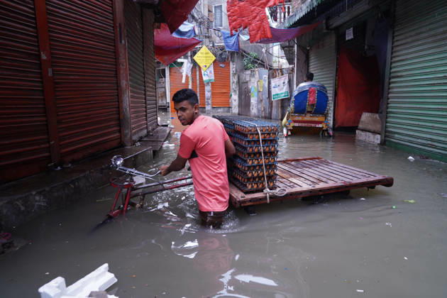 May 1, 2026, Dhaka, Dhaka, Bangladesh: DHAKA, BANGLADESH †May 1, 2026: After several hours of continuous rainfall, many small and major roads across the capital Dhaka were submerged, with water levels ranging from knee-deep to waist-deep in some areas. People forced to leave their homes for work faced severe difficulties, disrupting normal city life. Stray dogs and other animals were also left vulnerable in the flooded conditions. In many cases, clogged manholes filled with plastic waste and debris obstructed drainage systems, leading to widespread waterlogging. Dhaka Bangladesh - ZUMAk185 20260501_zip_k185_017 Copyright: xRubelxKarmakerx