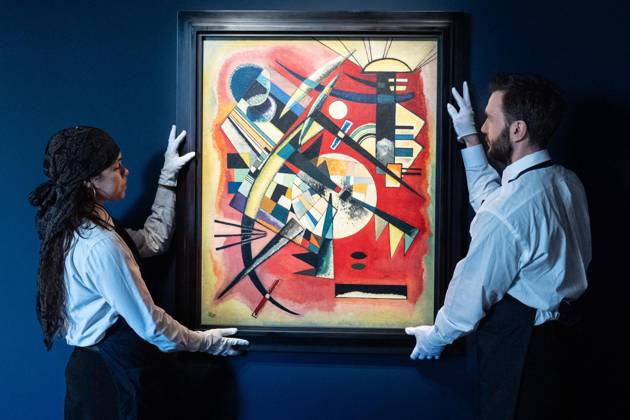 May 1, 2026, Bronx, New York, USA: Auction assistants pose with Wassily Kandinsky Rote Tiefe (Red Depth) during May Marquee Modern & Contemporary Auctions press preview at Sotheby s The Breuer in New York, NY on May 1, 2026. Bronx USA  - ZUMAr339 20260501_znp_r339_040 Copyright: xLevxRadinx