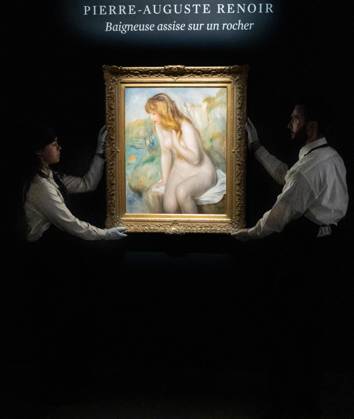 May 1, 2026, Bronx, New York, USA: Auction assistants pose with Pierre-Auguste Renoir Baigneuse assise sur un rocher during May Marquee Modern & Contemporary Auctions press preview at Sotheby s The Breuer in New York, NY on May 1, 2026. Bronx USA - ZUMAr339 20260501_znp_r339_028 Copyright: xLevxRadinx