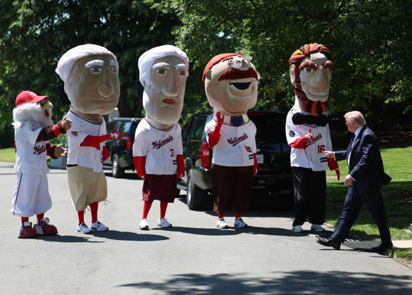 President Donald Trump greets the Washington Nationals Racing Presidents after signing a proclamation inside the Oval Office at the White House in Washington, on Tuesday, May 5, 2026. The memorandum is set to restore the Presidential Fitness Test Award, a competitive school-based fitness program last seen under the Obama administration.  WASP20260505108 TomxBrenner