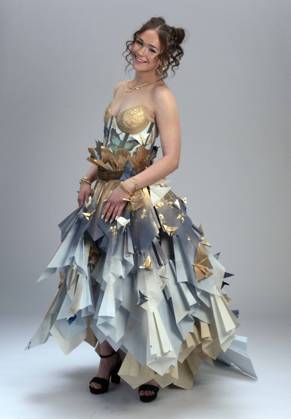 May 07,, 2026 - Denver, Colorado, USA - A model strikes a pose at the 20th Annual Denver Paper Fashion Show. Using only paper to create haute couture, fashion designers created dozens of wearable art designs for this year s show themed Folded in Time. Produced by the One Club for Creativity Denver, the runway show is a fundraiser for Downtown Aurora Visual Arts, which provides after-school arts programs for local youth. Denver USA  - ZUMAce6_ 20260507_zaf_ce6_002 Copyright: xBrianxCahnx