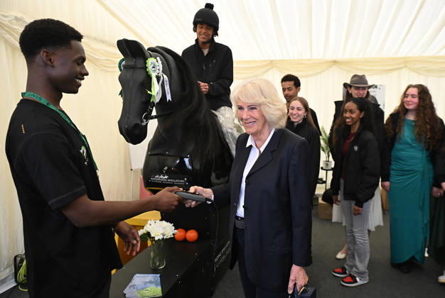 Queen Camilla meets Ebony Horse Club members Her Majesty, Queen Camilla, President of the Ebony Horse Club and Patron of the British Equestrian Federation, will meet members of the Ebony Horse Club as they demonstrate their skills during a short display at Badminton Horse Trials, which has selected Ebony Horse Club as its chosen charity this year. The Queen will also meet Badminton Horse Trials supporter and guests, including riders, past winners and representatives from the British Equestrian Federation. PIC: HRH The Queen meets riders and volunteers from Ebony Horse Club. Jason Hawkes (17) on the horse and Maxim Lawrence-Botu (22) youth worker., Credit:Eddie Mulholland PA ROTA - B68 Avalon UK, Badminton  Copyright: xEddiexMulhollandx xPAxROTAx-xB68x xAvalonx 1097354420