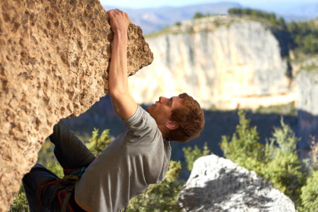 Rock, climbing and man with nature, exercise and fresh air with endurance, mountains and freedom with workout, sky and wellness. Person, athlete or guy with fitness, travel or environment with health. (License=RF) ,model released, Symbolfoto  Copyright: xZoonar.com YurixArcursx 21178993 ,model released, Symbolfoto ,property released
