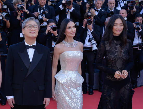 Electric Kiss Premiere at 79th Festival de Cannes - Cannes, France CANNES, FRANCE. May 12, 2026: Park Chan-Wook, Demi Moore & Chloe Zhao at the Grand Opening and premiere for The Electric Kiss at the 79th Festival de Cannes. Picture: Paul Smith Featureflash Cannes France  Copyright: xPaulxSmithx xFeatureflashx