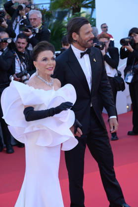 Electric Kiss Premiere at 79th Festival de Cannes - Cannes, France CANNES, FRANCE. May 12, 2026: Joan Collins & Laurent Lafitte at the Grand Opening and premiere for The Electric Kiss at the 79th Festival de Cannes. CAP GOL GOL Cannes Provence-Alpes-Côte d Azur France Copyright: xRickxGold CapitalxPicturesx