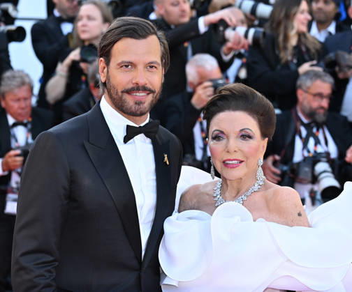 79th Cannes Film Festival: Opening Ceremony and the The Electric Kiss film screening CANNES, FRANCE - MAY 12: British actress Joan Collins (R) and French actor Laurent Lafitte (L) arrive for the Opening Ceremony and the screening of the film La Venus electrique (The Electric Kiss) at the 79th edition of the Cannes Film Festival in Cannes, France on May 12, 2026. Mustafa Yalcin Anadolu Cannes France. Editorial use only. Please get in touch for any other usage.  Copyright: x2026xAnadoluxMustafaxYalcinx