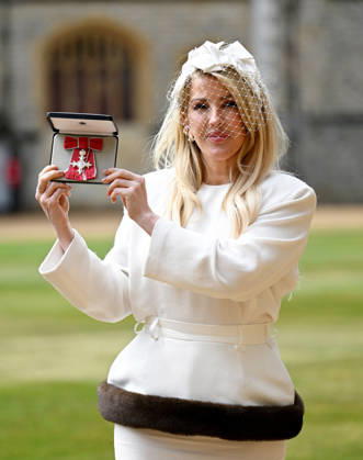 . 13 05 2026. Windsor, United Kingdom. Singer Ellie Goulding with her MBE after an Investiture at Windsor Castle, United Kingdom.  xPoolx xi-Imagesx IIM-26769-0005