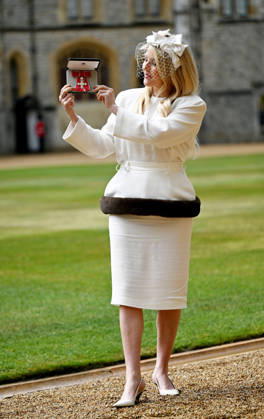 . 13 05 2026. Windsor, United Kingdom. Singer Ellie Goulding with her MBE after an Investiture at Windsor Castle, United Kingdom.  xPoolx xi-Imagesx IIM-26769-0006