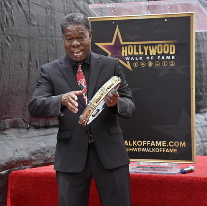Brazilian percussionist Paulinho da Costa beats on a tambourine during an unveiling ceremony honoring him with the 2,844th star on the Hollywood Walk of Fame in Los Angeles on Wednesday, May 13, 2026.  LAP2026051312 JIMxRUYMEN