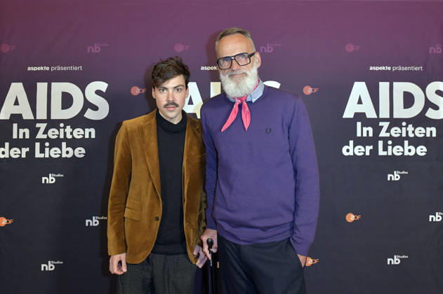 Aron Boks mit Gast bei der Preview der ZDF-Dokuserie AIDS - In Zeiten der Liebe im Kino International. Berlin, 13.05.2026