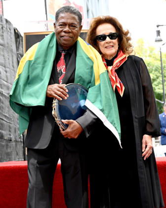Brazilian Percusionist Paulinho Da Costa Honored With A Star On The Hollywood Walk Of Fame in California, USA - 13 MAY 2026. Honoree, Paulinho Da Costa and his wife ,Arice Da Costa seen posing on The Star during the Walk of Fame star ceremony honoring Brazilian percussionist Paulinho Da Costa in Hollywood. California United States Copyright: xAlbertxL.xOrtegax xSOPAxImagesx DSC_3335