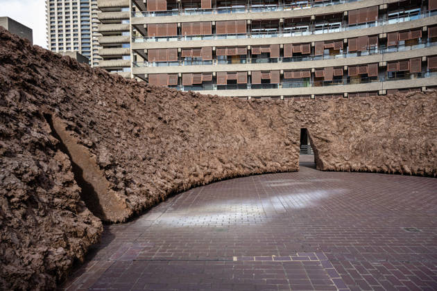 Delcy Morelos: origo at the Barbican Sculpture Court, London, UK 14 May 2026 origo, a monumental earthen sculpture by Colombian artist Delcy Morelos, on display at the Barbican Sculpture Court, London, UK, on 14 May 2026. The work spans roughly 24 x 18 metres and is hand-built with several tonnes of soil and aromatic spices including cinnamon and coffee, marking the first large-scale artistic commission in the Sculpture Court in ten years, on view from 15 May until 31 July 2026., Credit:Pete Speller Avalon Copyright: xPetexSpellerx xAvalonx 1098917782