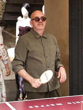 IPA84680221 - Rome, Laila Hasanovic attends the Antonio Marras boutique event. Pictured: Antonio Marras plays ping pong.  Copyright: xMarcoxProvvisionatox xMarcoxProvvisionatox 84680221