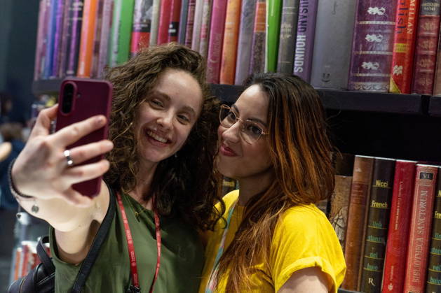 May 15, 2026, Turin, To, Italy: Some moments from the second day of the International Book Fair. Pictured are two young girls taking a selfie. Turin, May 15, 2026 Turin Italy  - ZUMAa289 20260515_zia_a289_008 Copyright: xSelenexDanielex xAgfx