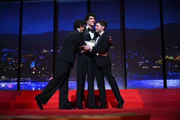 Cannes - Closing Ceremony Canadian filmmaker Xavier Dolan, Spanish director, screenwriter and producer Javier Ambrossi and Spanish director, screenwriter and producer Javier Calvo celebrate after winning the Best Director Prize for the film La Bola Negra during the closing ceremony of the 79th edition of the Cannes Film Festival in Cannes, France on May 23, 2026. Photo by Eliot Blondet ABACAPRESS.COM Cannes France  Copyright: xBlondetxEliot ABACAx