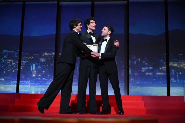 Cannes - Closing Ceremony Canadian filmmaker Xavier Dolan, Spanish director, screenwriter and producer Javier Ambrossi and Spanish director, screenwriter and producer Javier Calvo celebrate after winning the Best Director Prize for the film La Bola Negra during the closing ceremony of the 79th edition of the Cannes Film Festival in Cannes, France on May 23, 2026. Photo by Eliot Blondet ABACAPRESS.COM Cannes France  Copyright: xBlondetxEliot ABACAx