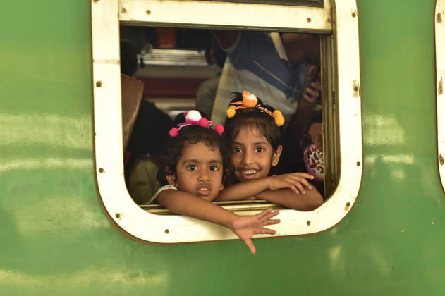 (260524) -- DHAKA, May 24, 2026 -- Children are pictured aboard a train during the Eid al-Adha travel rush at Kamalapur Railway Station in Dhaka, Bangladesh, May 24, 2026. As Eid al-Adha approaches, many people from Dhaka have streamed out of the city to join the festival with their kith and kin in hometowns. (Photo by Xinhua) BANGLADESH-DHAKA-AHEAD-EID AL-ADHA-TRAVEL RUSH HabiburxRahman 