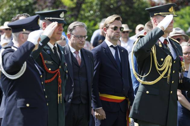 Prime Minister Bart De Wever (3L) and Kristof Chanterie pictured during the annual Memorial Day ceremony at the Flanders Field American Cemetery, in Waregem, Sunday 24 May 2026.  NICOLASxMAETERLINCK 174928987