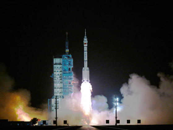 (260524) -- JIUQUAN, May 24, 2026 -- The Shenzhou-23 crewed spaceship, atop a Long March-2F carrier rocket, blasts off from the Jiuquan Satellite Launch Center in northwest China, May 24, 2026. China launched the Shenzhou-23 crewed spaceship on Sunday, which will send three astronauts to its orbiting Tiangong space station. ) FOCUS China launches Shenzhou-23 crewed spaceship LianxZhen 
