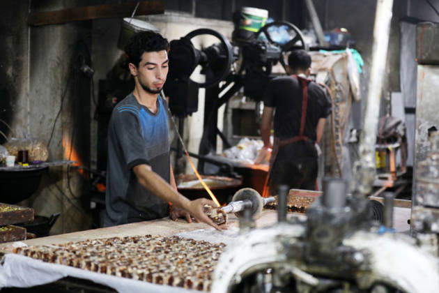 Palestinian workers produce traditional sweets ahead of Eid al-Adha Palestinian workers continued producing the traditional sweet known locally as Halakum at a factory in the Al-Daraj neighborhood, east of Gaza City, on May 24, 2026, ahead of Eid al-Adha. The factory resumed operations with limited resources after sustaining damage from Israeli airstrikes during the war. Halakum is a traditional sweet widely consumed during holidays, and the factory strives to provide it to residents despite the difficult living conditions and sharp decline in purchasing power in the Gaza Strip before Eid al-Adha. Photo by Bilal Osama apaimages Gaza city Gaza Strip Palestinian Territory 240526_Gaza_BO_01(35) Copyright: xapaimagesxBilalxOsamax xapaimagesx