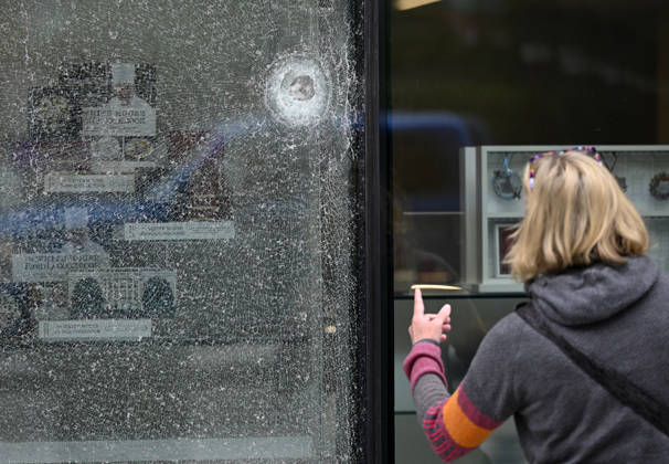 Bullet holes and shattered glass remain at The People s House near White House Complex Bullet holes and shattered glass remain at The People s House, on May 24, 2026, in Washington, DC after the U.S. Secret Service shot a person near the White House on Saturday. On Saturday, May 23, two people were struck in a shooting near the intersection of Pennsylvania Avenue and 17th Street Northwest, located just outside the White House complex. Photo by Olivier Douliery ABACAPRESS.COM Washington DC United States  Copyright: xDoulieryxOlivier ABACAx