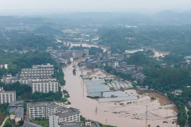 CHONGQING, CHINA - MAY 24: Rows of greenhouses are submerged after extreme rainfalls trigger flash floods and geological disasters on May 24, 2026 in Yongchuan District, Chongqing City, China. Devastating rainstorms struck parts of Southwest China s Chongqing over the weekend, resulting in multiple casualties and missing people in the municipality s Yongchuan and Beibei districts. Rescue efforts are ongoing. As of 2:30 pm on May 24, local authorities reported three deaths and 17 people missing in Yongchuan, with another two people missing in Beibei.  Copyright: xChinaxNewsxServicex 111643812993
