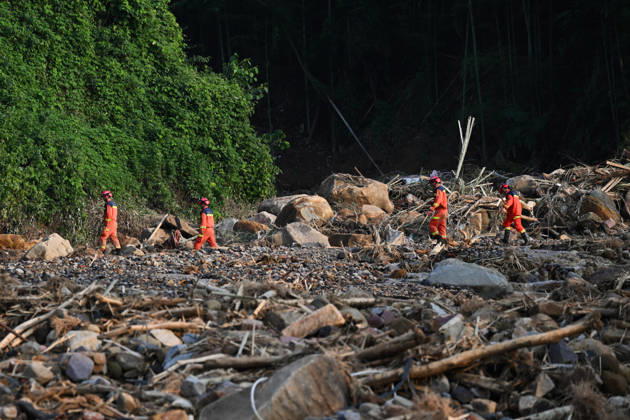 CHONGQING, CHINA - MAY 24: Rescue workers carry out search and rescue operations after extreme rainfalls trigger flash floods and geological disasters on May 24, 2026 in Yongchuan District, Chongqing City, China. Devastating rainstorms struck parts of Southwest China s Chongqing over the weekend, resulting in multiple casualties and missing people in the municipality s Yongchuan and Beibei districts. Rescue efforts are ongoing. As of 2:30 pm on May 24, local authorities reported three deaths and 17 people missing in Yongchuan, with another two people missing in Beibei.  Copyright: xChinaxNewsxServicex 111643846458