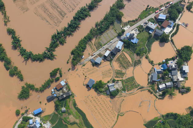 CHONGQING, CHINA - MAY 24: Aerial view of flooded Anxi Village after extreme rainfalls trigger flash floods and geological disasters on May 24, 2026 in Yongchuan District, Chongqing City, China. Devastating rainstorms struck parts of Southwest China s Chongqing over the weekend, resulting in multiple casualties and missing people in the municipality s Yongchuan and Beibei districts. Rescue efforts are ongoing. As of 2:30 pm on May 24, local authorities reported three deaths and 17 people missing in Yongchuan, with another two people missing in Beibei.  Copyright: xChinaxNewsxServicex 111643846468