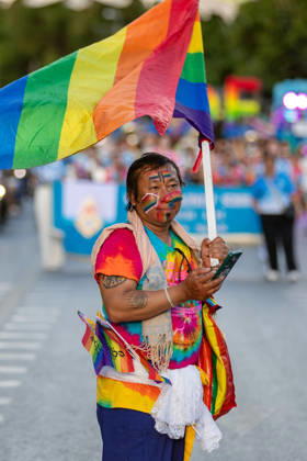 May 24, 2026, Chiang Mai, Thailand: A participant dressed in colorful clothing carries a rainbow flag during The Chiang Mai Pride Parade 2026 during celebrations. The Chiang Mai Pride Parade 2026 took place in Chiang Mai, Thailand. Chiang Mai province holds Thailandis first Pride Month celebrations annually, promoting gender equality, diversity, and human rights as part of Pride Month activities in northern Thailand. Chiang Mai Thailand - ZUMAs197 20260524_aaa_s197_113 Copyright: xPongmanatxTasirix