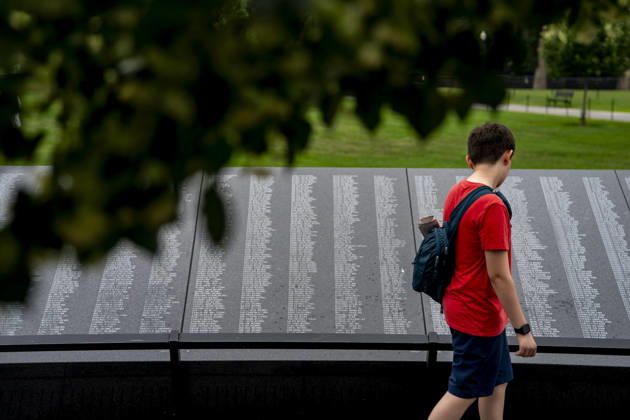 A boy reads names at the Korean War Memorial on Memorial Day in Washington, DC on Monday, May 25, 2026.  WAP20260525339 BONNIExCASH