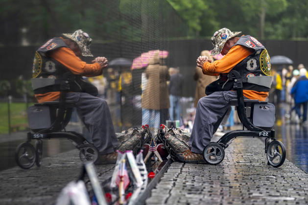 A Gulf War veteran pays his respects at the Vietnam Veterans Memorial on Memorial Day in Washington, DC on Monday, May 25, 2026.  WAP20260525303 BONNIExCASH