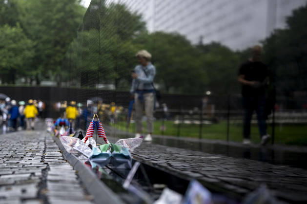 Flags, notes, and mementos are left at the Vietnam Veterans Memorial on Memorial Day in Washington, DC on Monday, May 25, 2026.  WAP20260525311 BONNIExCASH