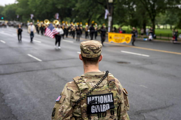 Members of the National Guard patrol the Memorial Day Parade as it passes down Constitution Avenue on Memorial Day in Washington, DC on Monday, May 25, 2026.  WAP20260525335 BONNIExCASH