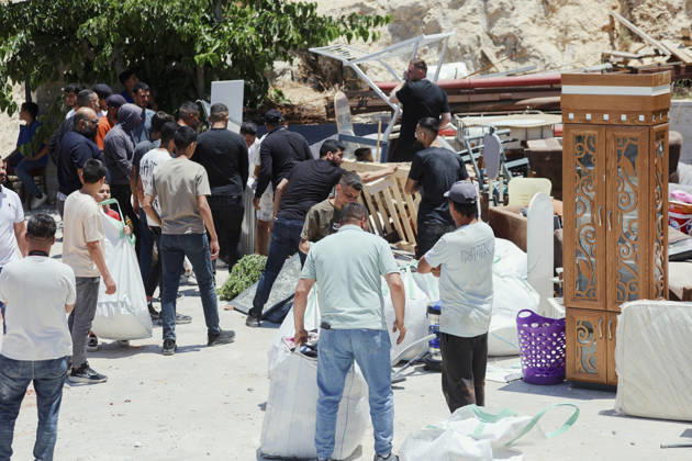 Israeli Demolition West Bank Family Displaced Eid Al-Adha People stand near salvaged furniture and household items gathered outside a destroyed home in Nahhalin, occupied West Bank, on May 25, 2026. The demolition, carried out by Israeli forces who stated the structure was built without a permit, displaced an eight-member Palestinian family just two days before the Islamic holiday of Eid al-Adha. Bethlehem West Bank Palestinian Territories Copyright: xMosabxShawerx