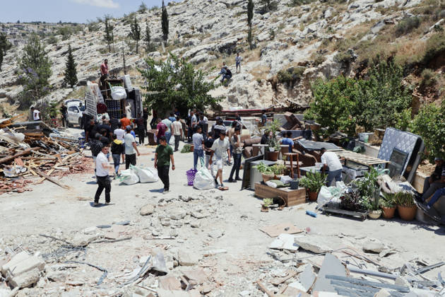 Israeli Demolition West Bank Family Displaced Eid Al-Adha People gather around salvaged furniture and load belongings onto a truck following a home demolition in Nahhalin, occupied West Bank, on May 25, 2026. The demolition, carried out by Israeli forces who stated the structure was built without a permit, displaced an eight-member Palestinian family just two days before the Islamic holiday of Eid al-Adha. Bethlehem West Bank Palestinian Territories Copyright: xMosabxShawerx