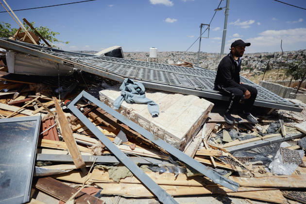 Israeli Demolition West Bank Family Displaced Eid Al-Adha A man sits on a metal gate resting on top of rubble following a home demolition in Nahhalin, occupied West Bank, on May 25, 2026. The demolition, carried out by Israeli forces who stated the structure was built without a permit, displaced an eight-member Palestinian family just two days before the Islamic holiday of Eid al-Adha. Bethlehem West Bank Palestinian Territories Copyright: xMosabxShawerx