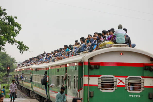 May 26, 2026, Tongi, Bangladesh: Bangladeshi Muslim passengers struggle to board an overcrowded train as they travel home ahead of the upcoming Eid al-Adha festival at a railway station in Tongi, near Dhaka, Bangladesh, Monday, May 26, 2024. Millions of people are expected to leave the capital in one of the countryÃ¢â‚¬â ¢s largest annual holiday exoduses to celebrate Eid with their families in rural areas. Tongi Bangladesh - ZUMAd117 20260526_fap_d117_006 Copyright: xSuvraxKantixDasx