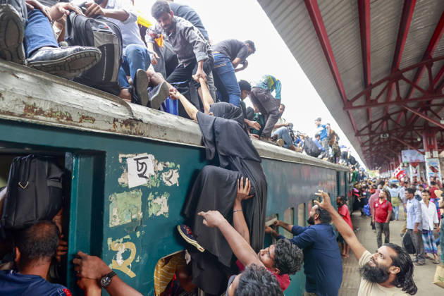 May 26, 2026, Tongi, Bangladesh: Bangladeshi Muslim passengers struggle to board an overcrowded train as they travel home ahead of the upcoming Eid al-Adha festival at a railway station in Tongi, near Dhaka, Bangladesh, Monday, May 26, 2024. Millions of people are expected to leave the capital in one of the countryÃ¢â‚¬â ¢s largest annual holiday exoduses to celebrate Eid with their families in rural areas. Tongi Bangladesh  - ZUMAd117 20260526_fap_d117_042 Copyright: xSuvraxKantixDasx