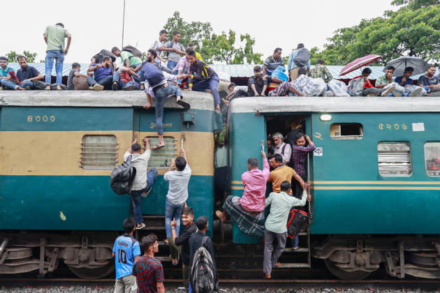 May 26, 2026, Tongi, Bangladesh: Bangladeshi Muslim passengers struggle to board an overcrowded train as they travel home ahead of the upcoming Eid al-Adha festival at a railway station in Tongi, near Dhaka, Bangladesh, Monday, May 26, 2024. Millions of people are expected to leave the capital in one of the countryÃ¢â‚¬â ¢s largest annual holiday exoduses to celebrate Eid with their families in rural areas. Tongi Bangladesh - ZUMAd117 20260526_fap_d117_031 Copyright: xSuvraxKantixDasx