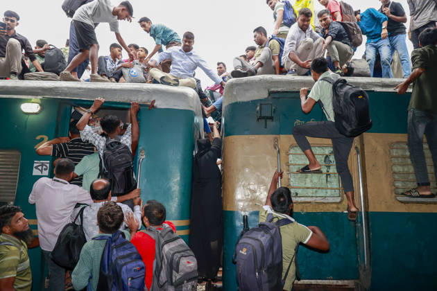 May 26, 2026, Tongi, Bangladesh: Bangladeshi Muslim passengers struggle to board an overcrowded train as they travel home ahead of the upcoming Eid al-Adha festival at a railway station in Tongi, near Dhaka, Bangladesh, Monday, May 26, 2024. Millions of people are expected to leave the capital in one of the countryÃ¢â‚¬â ¢s largest annual holiday exoduses to celebrate Eid with their families in rural areas. Tongi Bangladesh - ZUMAd117 20260526_fap_d117_032 Copyright: xSuvraxKantixDasx