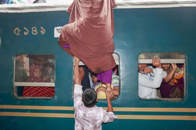 May 26, 2026, Tongi, Bangladesh: Bangladeshi Muslim passengers struggle to board an overcrowded train as they travel home ahead of the upcoming Eid al-Adha festival at a railway station in Tongi, near Dhaka, Bangladesh, Monday, May 26, 2024. Millions of people are expected to leave the capital in one of the countryÃ¢â‚¬â ¢s largest annual holiday exoduses to celebrate Eid with their families in rural areas. Tongi Bangladesh - ZUMAd117 20260526_fap_d117_038 Copyright: xSuvraxKantixDasx
